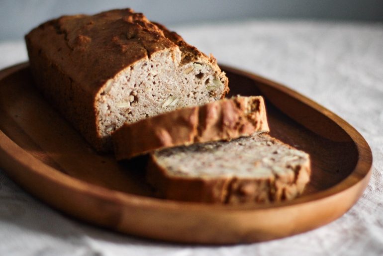 close up photo of sliced bread on oval wooden plate