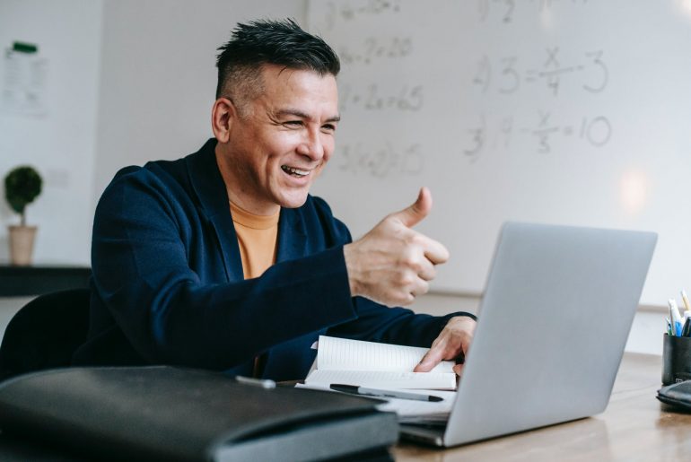 photo of man doing thumbs up