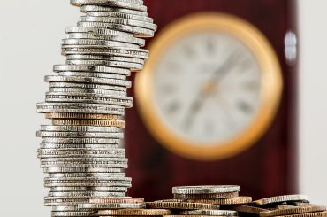 selective focus photo of stacked coins