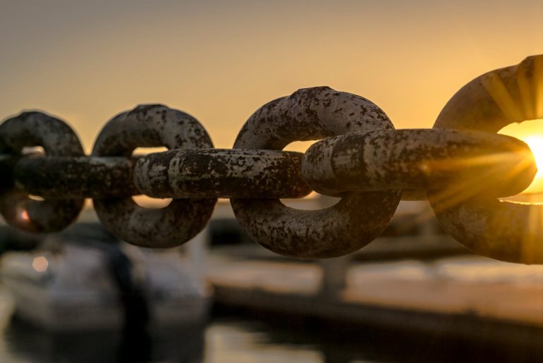 selective focus photoraphy of chains during golden hour