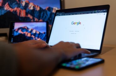 close up shot of a person using a laptop